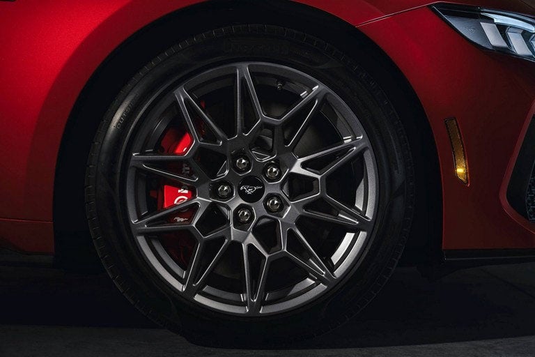 2024 Ford Mustang® model with a close-up of a wheel and brake caliper | Flagship Ford in Baldwin WI