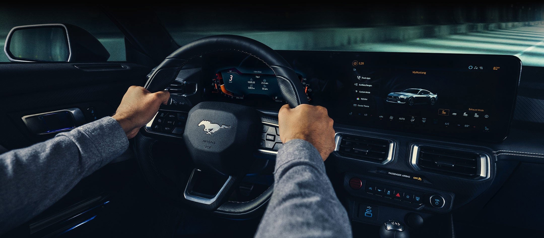 A 2024 Ford Mustang® model interior with a person driving | Flagship Ford in Baldwin WI
